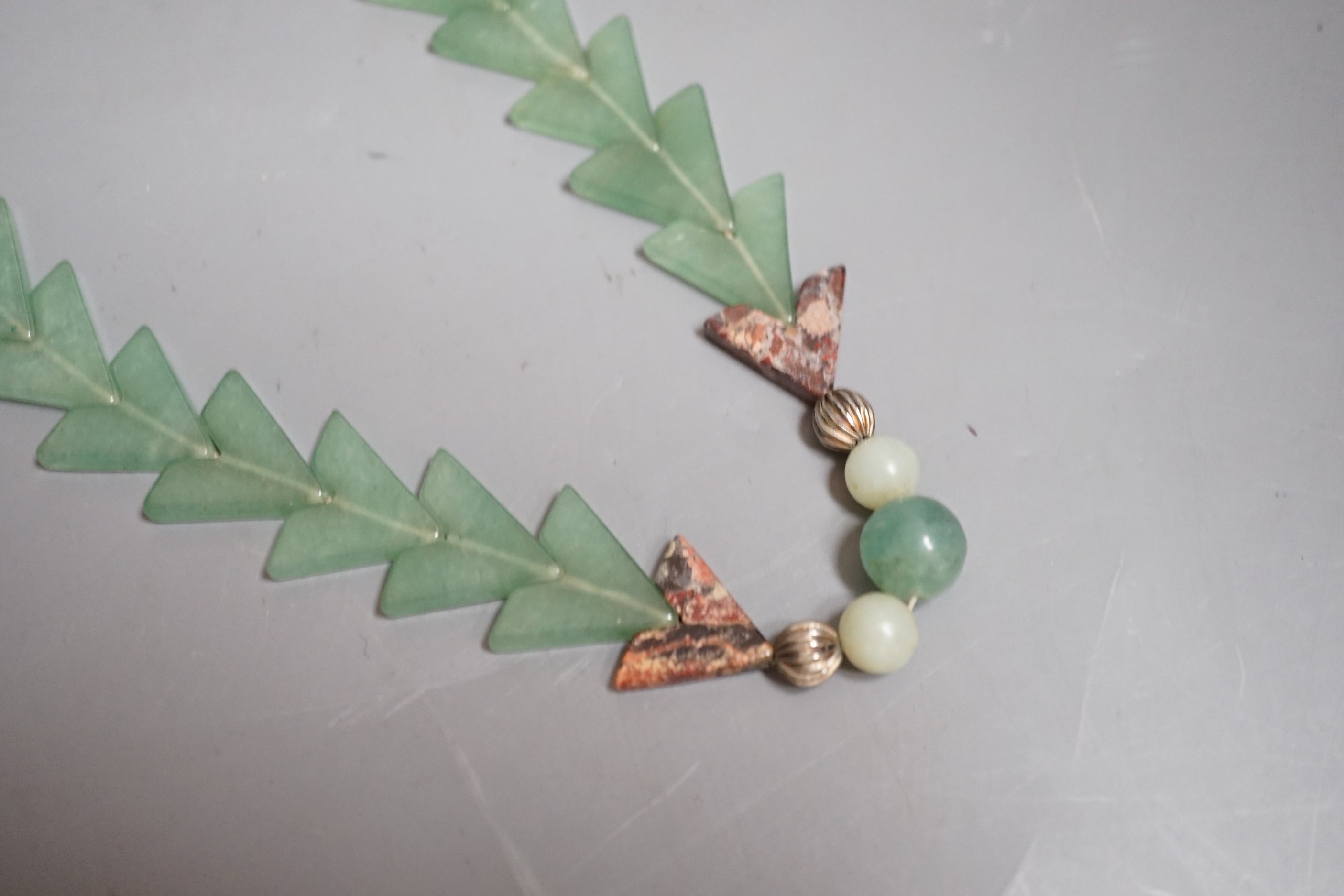 A Chinese jade arrowed pendant necklace